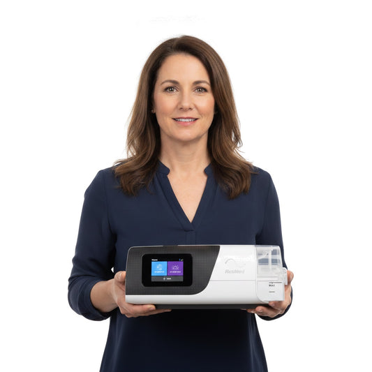ResMed AirSense 11 on a bedside nightstand
