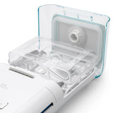 The seal fitted inside the open flip lid of a DreamStation heated humidifier, water chamber below