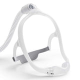 Angled view of the DreamWear frame and cushion with the CPAP hose attached at the top of the head