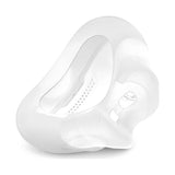 Three-quarter view of the AirFit F30i cushion, showing its compact, curved under-the-nose shape