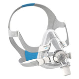 Front view of AirTouch F20 full face mask displaying complete headgear assembly with blue comfort pads and magnetic clips