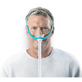 Man wearing the Evora nasal mask, showing how little of the face the CapFit headgear covers