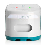 Photograph of the closed Lumin device from a straight-on front view, showing the control panel lights