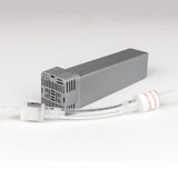A cartridge filter and check valve laid diagonally on a soft grey background