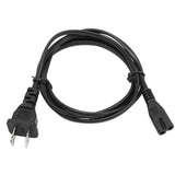Black AC power cord in one loose loop, the wall plug pointing down and the figure-8 end at right