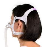 Woman wearing ResMed AirFit N20 For Her Nasal CPAP Mask - side profile showing lavender-accented headgear and minimal facial contact