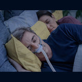 Couple sleeping comfortably with AirFit N30 nasal cradle CPAP mask during sleep therapy