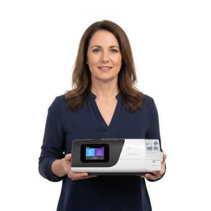 ResMed AirSense 11 on a bedside nightstand