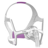 Angled view of the AirTouch N20 For Her with lavender headgear panels, clear cushion and short Flexi-Tube