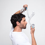 Photograph of a man lifting the AirTouch F30i Clear frame over his head with the cushion below his nose