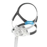 Angled view of the AirTouch F40 from the right, showing the headgear size tag and the magnetic lower clips