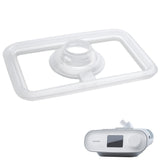 DreamStation humidifier lid seal on white, with a small DreamStation machine shown beside it for scale