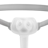 Front view of the Solo AirPillow cushion showing both nostril openings and the gray headgear straps either side