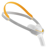 Fisher and Paykel Solo nasal mask with its gold crown strap and under nose cushion