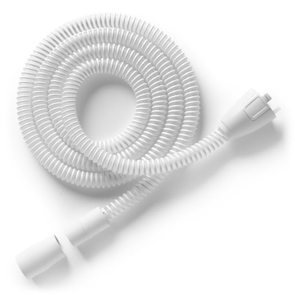 Philips DreamStation 2 heated Micro-Flex tube, tightly coiled white accordion-style tube on a plain background