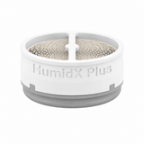 Single ResMed HumidX Plus cartridge level on white, gray base ring and the mesh exchange core visible