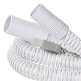 Close-up of both cuff ends and the gray heater-wire power plug on the Luna G3 heated tube