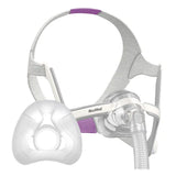 ResMed AirFit N20 For Her nasal mask with purple headgear, shown beside a loose replacement silicone cushion