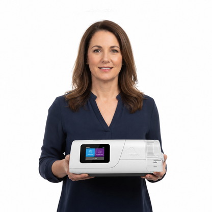 A woman holding the ResMed AirCurve 11 VAuto, showing how compact the machine is in two hands