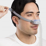 Man wearing ResMed AirFit N30 under-the-nose CPAP mask showing comfortable fit and minimal design