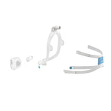 The AirFit X30i taken apart into its oral cushion, nasal pillows, frame with elbow, and headgear